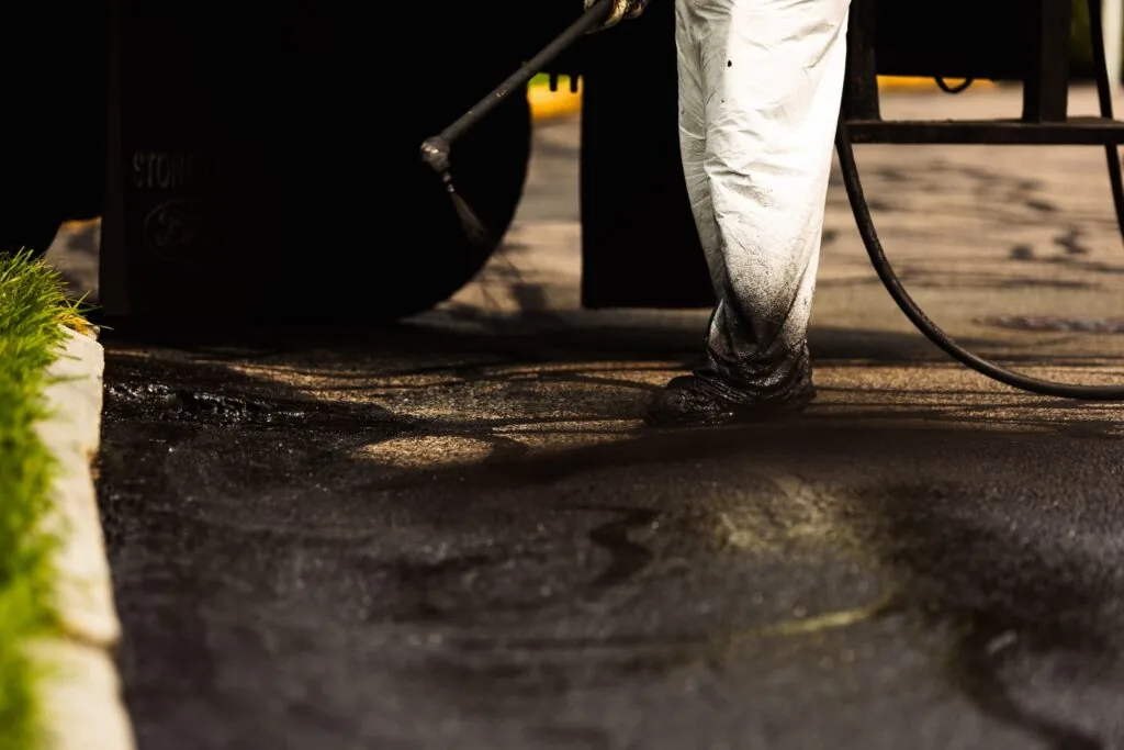 person applying sealcoat