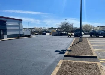 U.S. pavement employees working on a papa ginos parking lot