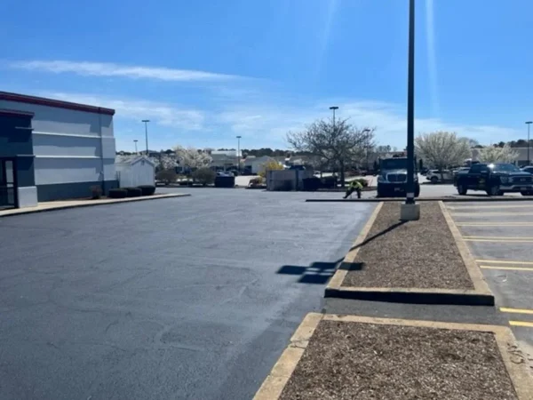 U.S. pavement employees working on a papa ginos parking lot