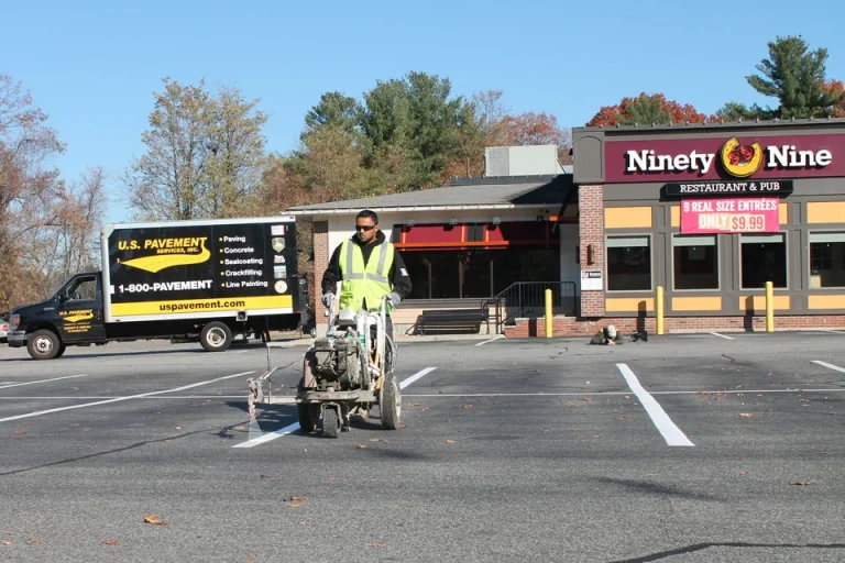 u.s. pavement employee operating a line striping machine