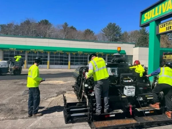 U.S. pavement employees working on a Sullivan tire