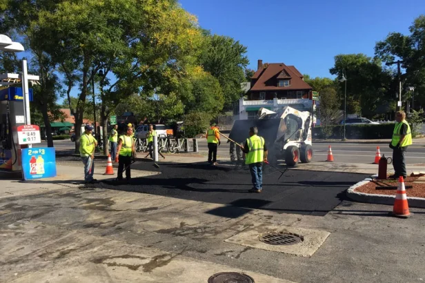 u.s. pavement employees patching asphalt