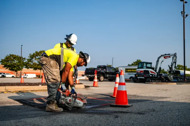U.S. Pavement employees using a circle saw